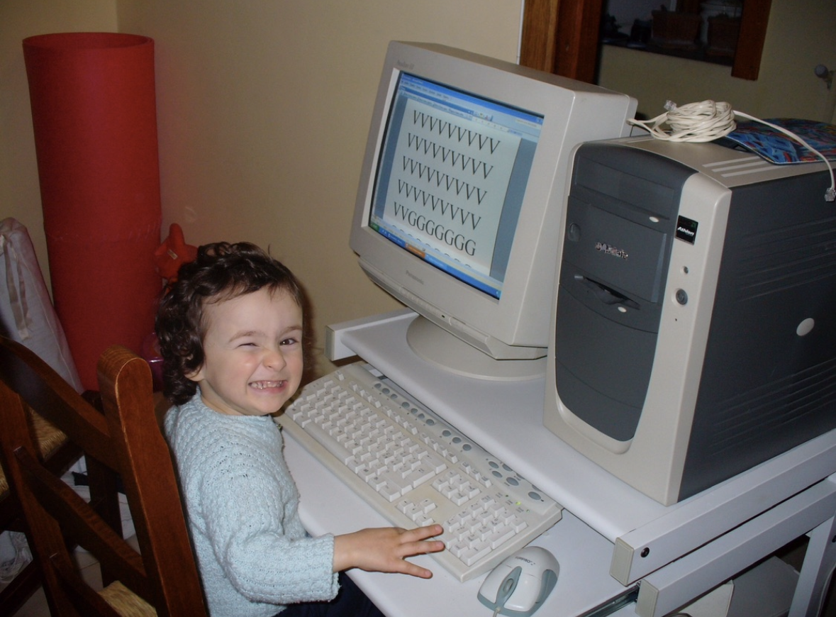 Claudia as a child at a computer